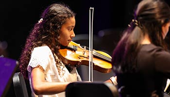 student playing a violin